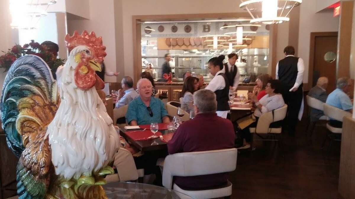 A rooster oversees the dining room at Bocuse.