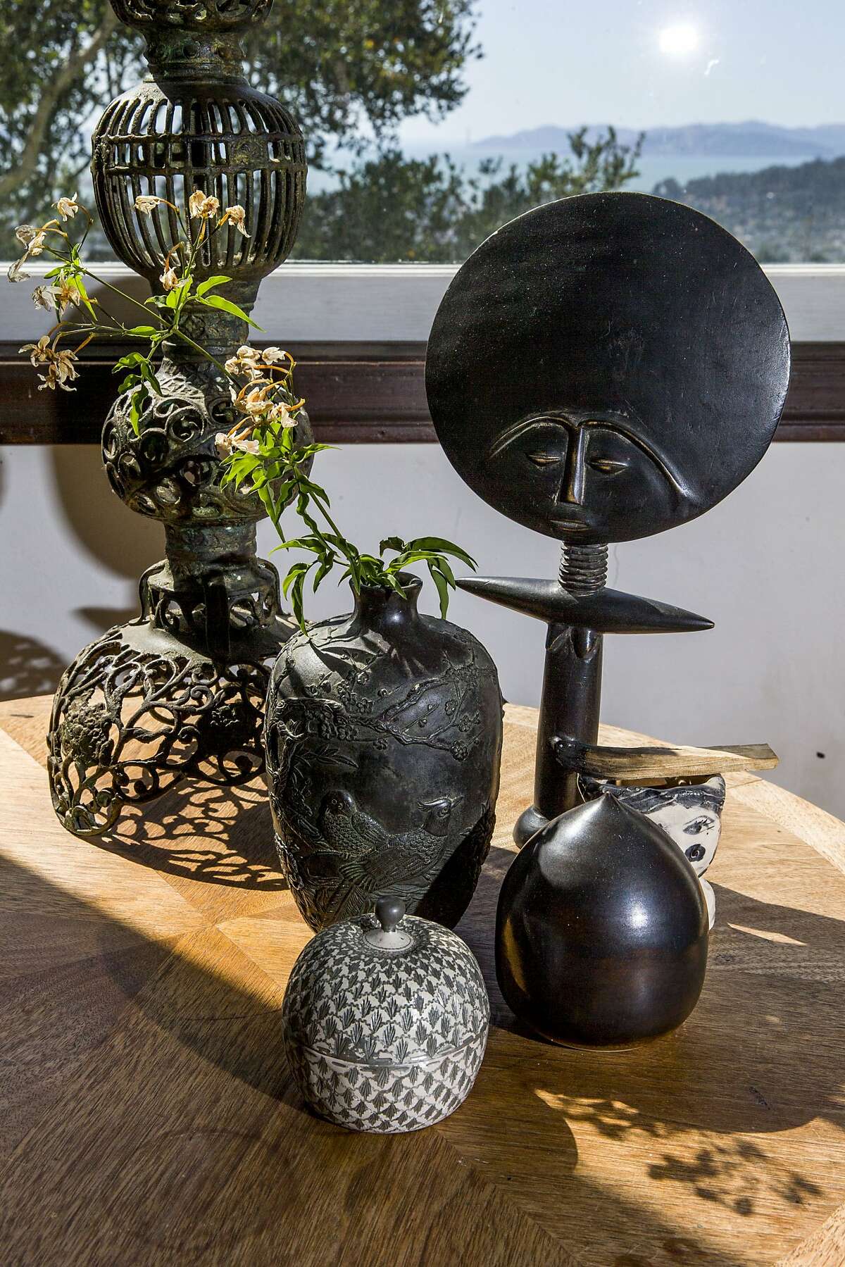 Len Carella ceramics as well as a piece her daughter made and other trinkets at the home of fashion designer Erica Tanov on Tuesday, Oct. 3, 2017, in Berkeley, Calif.