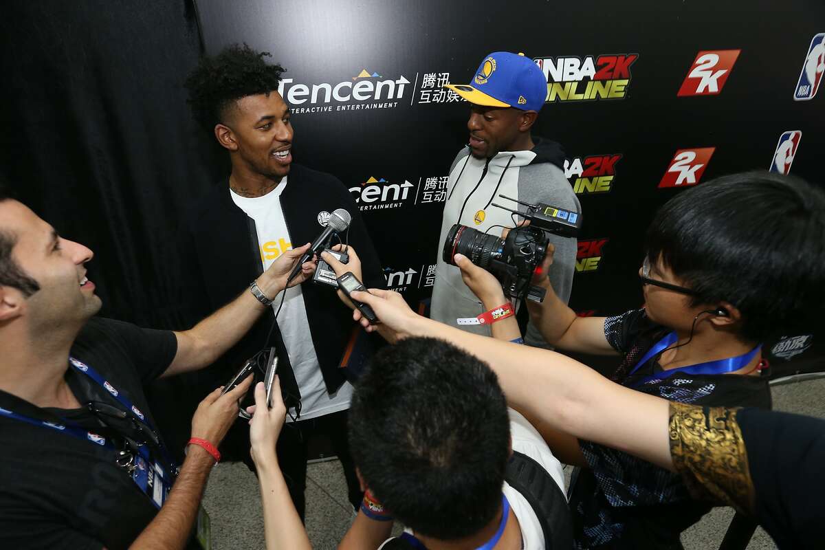 Nick Young and Andre Iguodala are interviewed by reporters Wednesday night in Shenzhen, China.