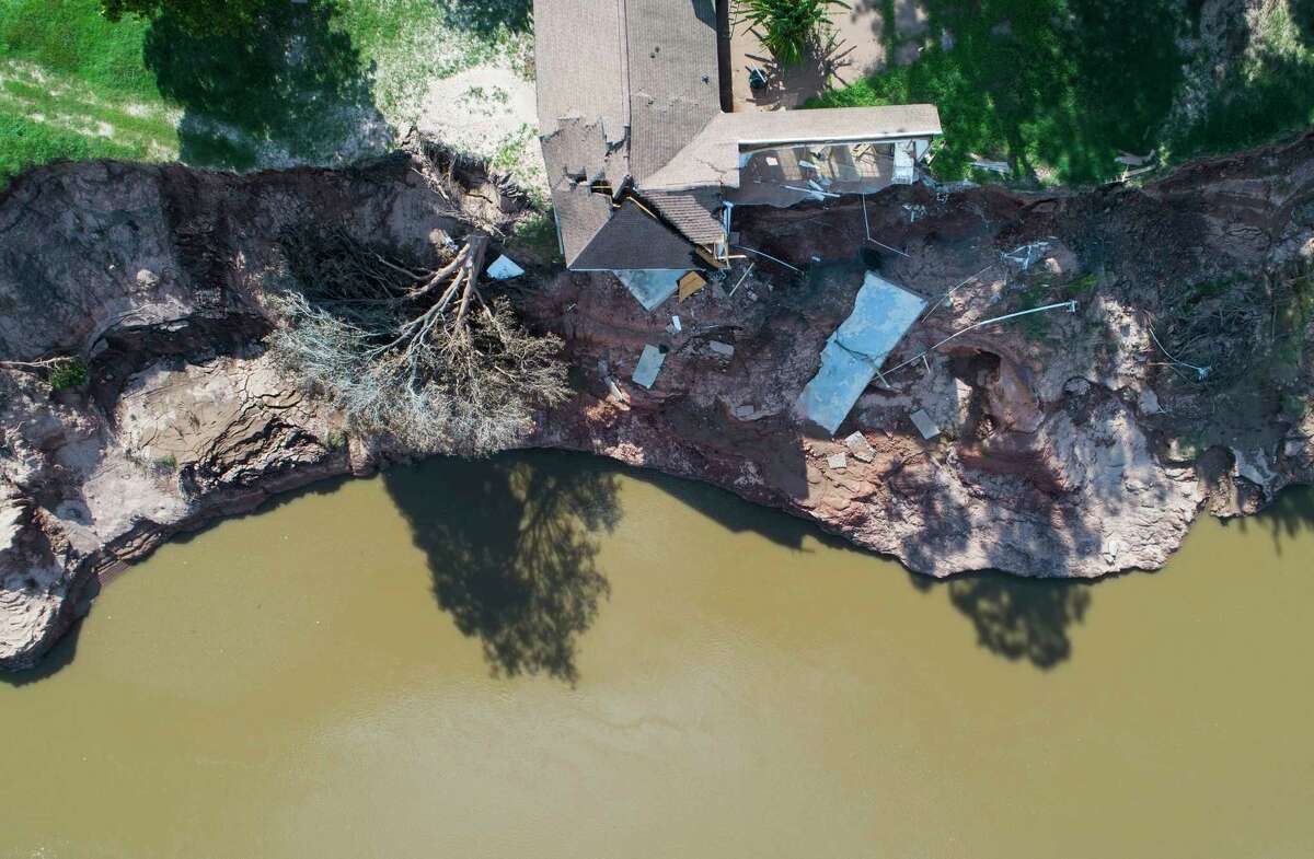 A house that was already condemned is now hanging into the Brazos River in Simonton. The house was not falling into the river before Hurricane Harvey.