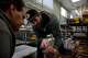 Michael Murphy (right), produce quality control and buyer, shows Jason Crayne (left), receiving, inventory and quality control, a box of strawberries as they decide on which produce they'll accept during a delivery at the Farmstead San Mateo hub on Tuesday, October 3, 2017 in San Mateo, Calif.
