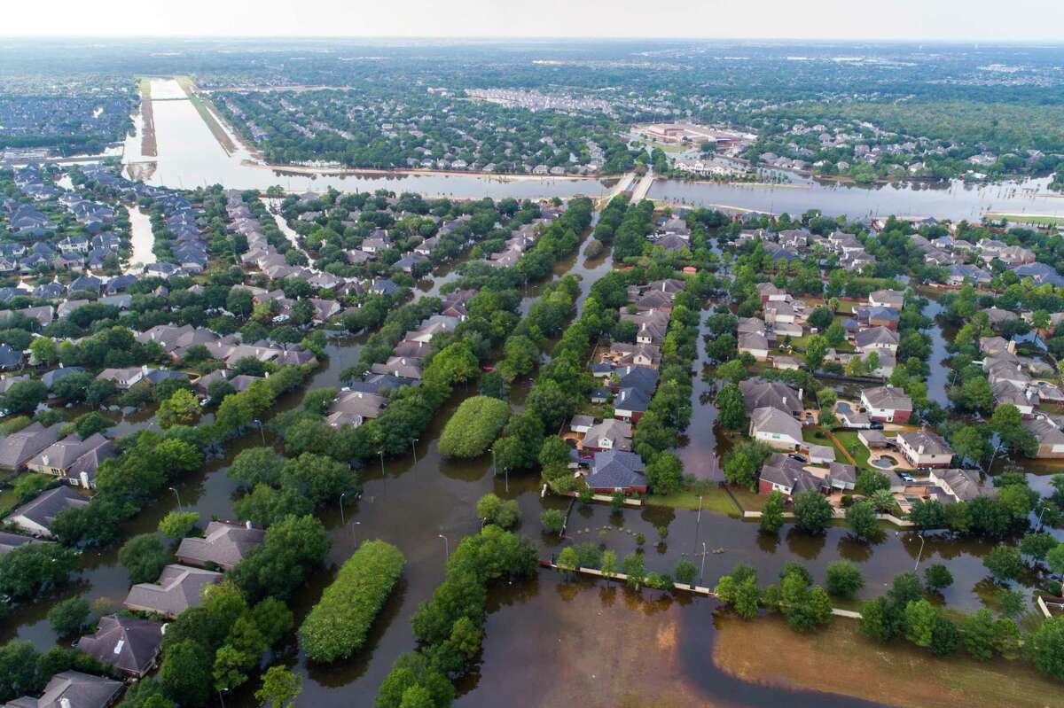 Homes in the Cinco Ranch area are surrounded by water from the Barker Reservoir on Sept. 2. (Mark Mulligan / Houston Chronicle)