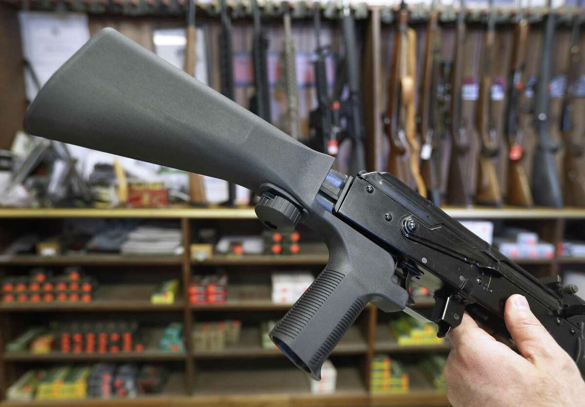 A bump stock device (left), that fits on a semi-automatic rifle to increase the firing speed making it similar to a fully automatic rifle, is installed on a AK-47 semi-automatic rifle (right), at a gun store on October 5, 2017 in Salt Lake City, Utah. Congress is talking about banning this device after it was reported to of been used in the Las Vegas shootings on October 1, 2017.