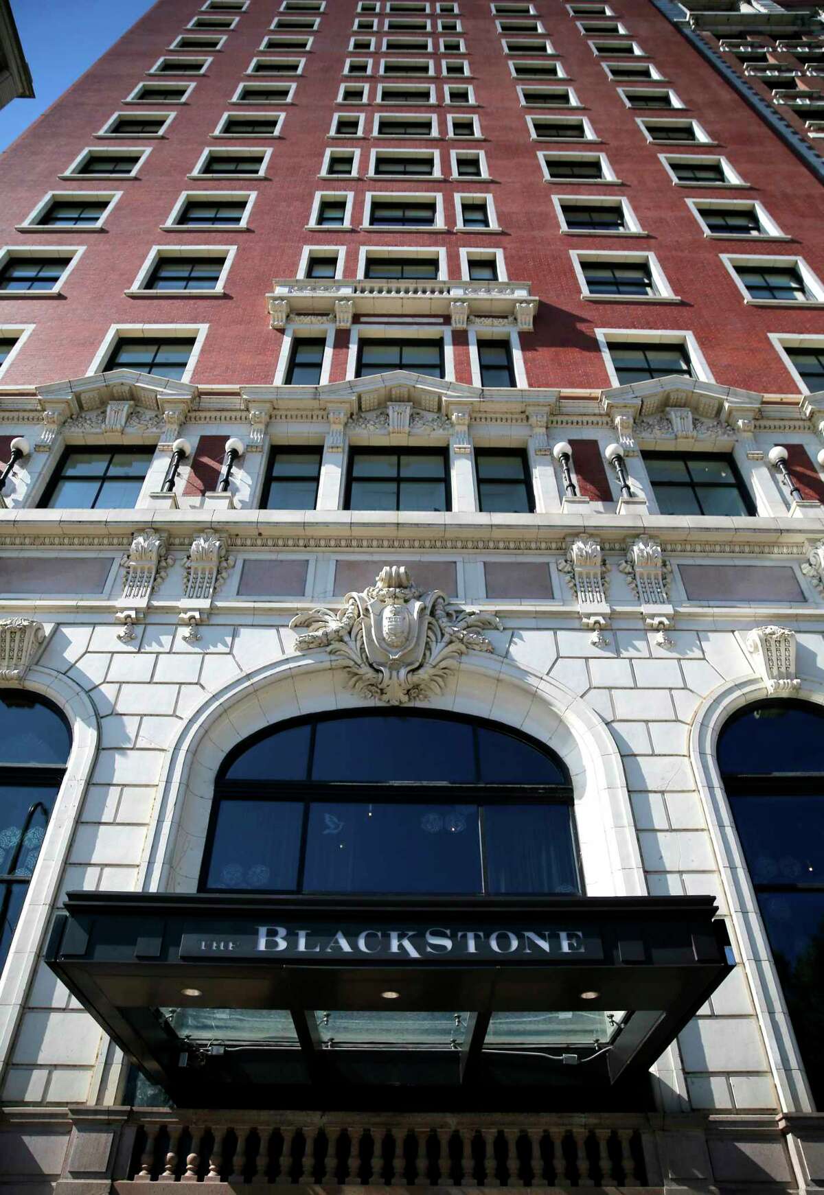 The Blackstone Hotel sits on Michigan Avenue across the street from Chicago's Grant Park on Thursday, Oct. 5, 2017, in Chicago. Stephen Paddock, opened fire on an outdoor music concert on Sunday, Oct. 1, killing dozens and injuring hundreds in Las Vegas. In August, Paddock, booked a room at the Blackstone Hotel that overlooks the park where the Lollapalooza music festival was held that weekend, a law enforcement official said Thursday, Oct. 5, 2017. (AP Photo/Charles Rex Arbogast)