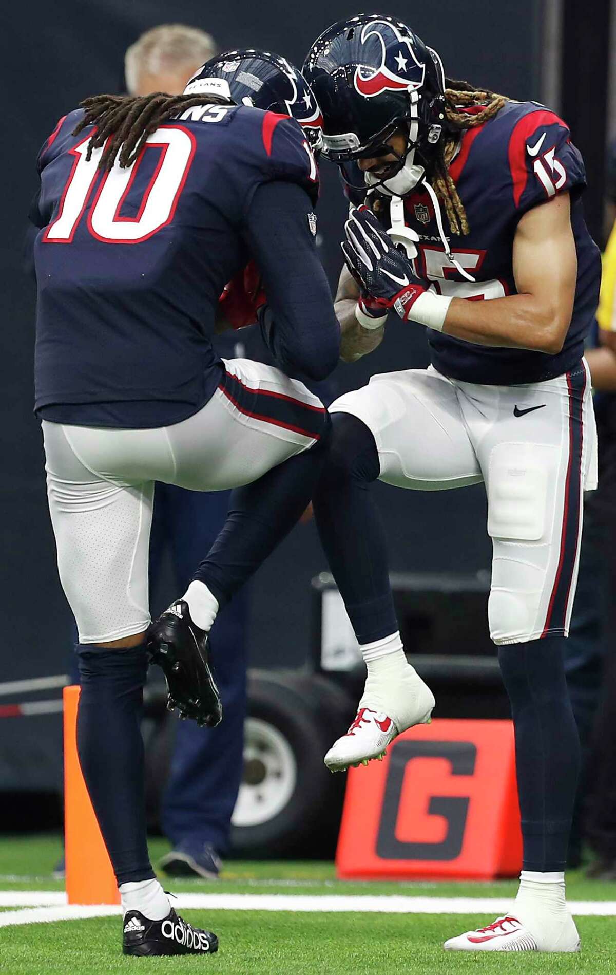 Texans wide receiver DeAndre Hopkins, left, was definitely happy to see the return of Will Fuller in last Sunday's game, a 57-14 win over the Titans.