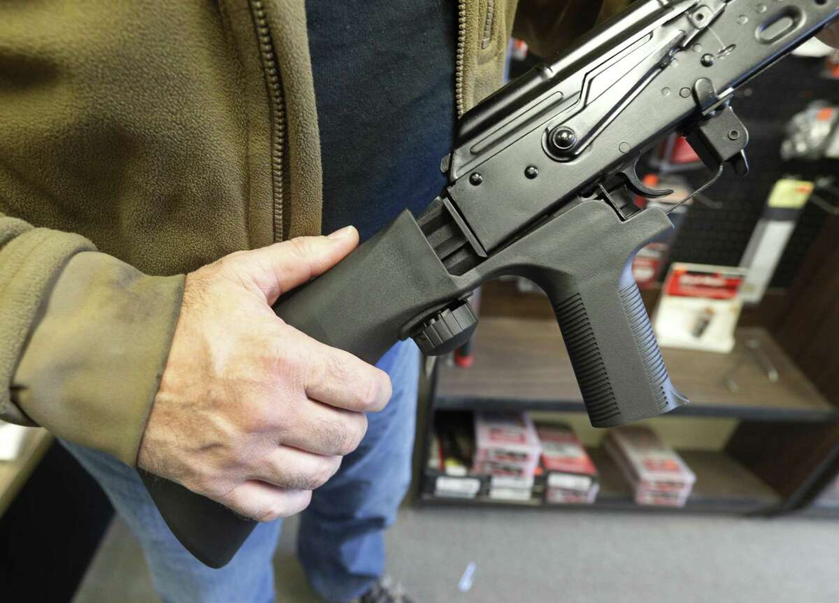 SALT LAKE CITY, UT - OCTOBER 5: A bump stock device, (left) that fits on a semi-automatic rifle to increase the firing speed, making it similar to a fully automatic rifle, is installed on a AK-47 semi-automatic rifle, (right) at a gun store on October 5, 2017 in Salt Lake City, Utah. Congress is talking about banning this device after it was reported to of been used in the Las Vegas shootings on October 1, 2017. (Photo by George Frey/Getty Images)