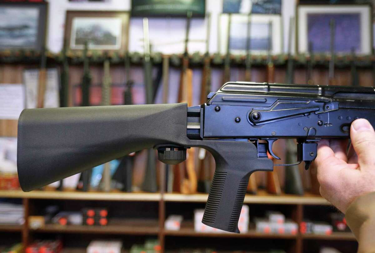 SALT LAKE CITY, UT - OCTOBER 5: A bump stock device (left) that fits on a semi-automatic rifle to increase the firing speed, making it similar to a fully automatic rifle, is installed on a AK-47 semi-automatic rifle, (right) at a gun store on October 5, 2017 in Salt Lake City, Utah. Congress is talking about banning this device after it was reported to of been used in the Las Vegas shootings on October 1, 2017. (Photo by George Frey/Getty Images) *** BESTPIX *** ORG XMIT: 775055031