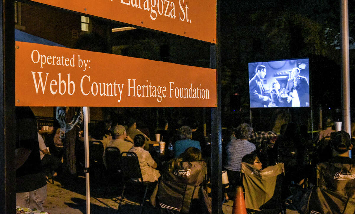 Laredoans watch a screening of Frankenstein Meets The Wolf Man on Friday night at the Villa Antigua Border Heritage Museum during it's movies on the patio night. The movie is the first of three screenings of classic horror films with the next movie set for October 14th, 2016.