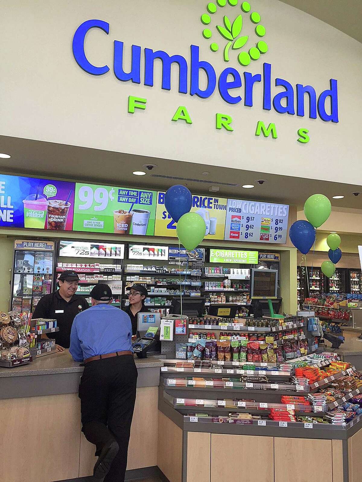 Cumberland Farms employees talk in the newly designed and built store in New Milford, Conn., on Thursday, Oct. 5, 2017.