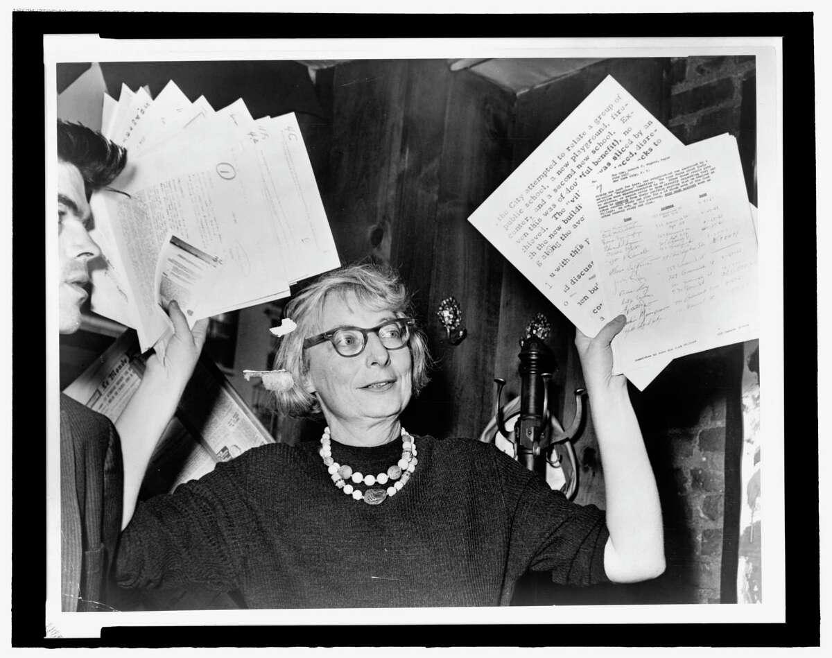 Jane Jacobs, as head of the Committee to Save the West Village, holds up documentary evidence at a press conference at in 1961, one of several battles she waged to preserve her neighborhood from redevelopment. A film festival that will examine her legacy and her influence on planning will be held at the Bijou Theatre in Bridgeport.