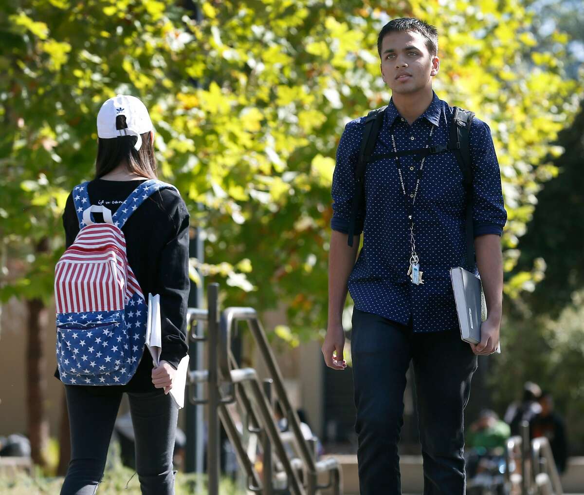 Neeraj Dharmadhikari, a computer science major, walks to his next class at De Anza College in Cupertino, Calif. on Tuesday, Oct. 3, 2017.