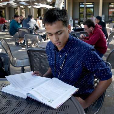 Computer science student Neeraj Dharmadhikari prepares for an advanced physics class at De Anza College in Cupertino, Calif. on Tuesday, Oct. 3, 2017.