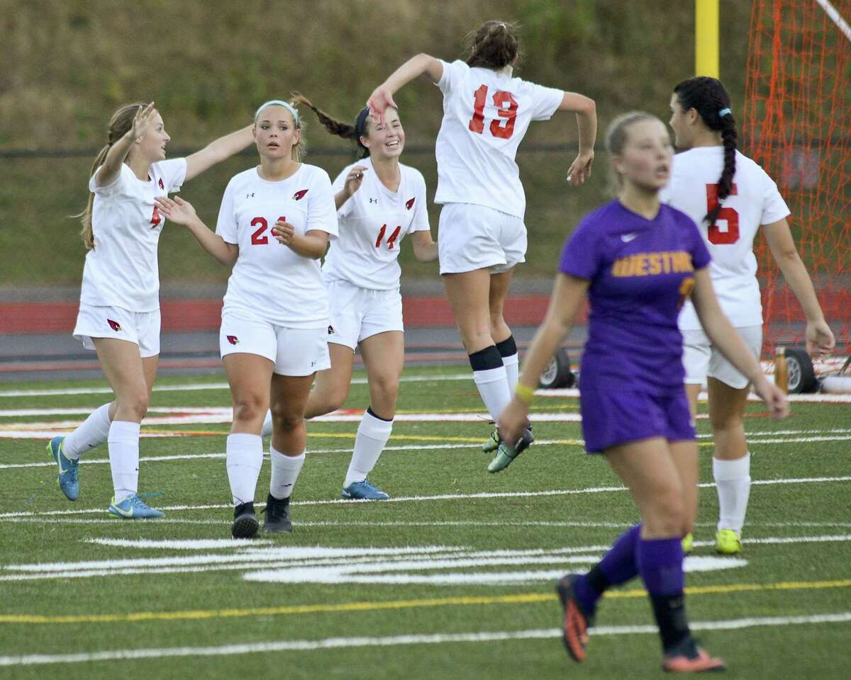 Greenwich Sofia Zajec (14) and Willow Wolfe (19) celebrate the Lady Cardinals 4-3 win over Westhill in an FCIAC girls soccer game at Cardinal Stadium in Greenwich, Connecticut on Friday, Oct. 6, 2017.