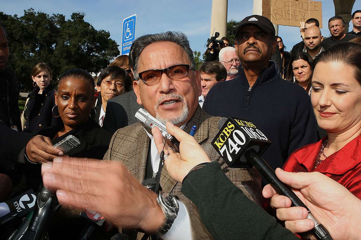 Oakland city council members Desley Brooks (left), Ignacio De La Fuente (front), Larry Reid (back,middle), Libby Schaaf (front, right) and several business owners met at the bandstand next to Lake Merritt in Oakland, Calif., as they try to voice their opinions over Occupy Oakland chants on Wednesday, November 9, 2011