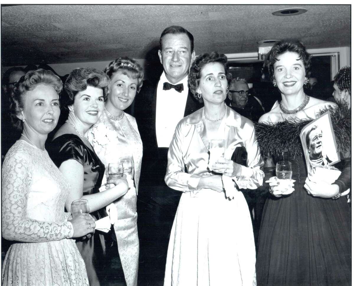 John Wayne was popular with local women during a party for the premiere of his film "The Alamo" in 1960. The St. Anthony Hotel hosted a cocktail party for 900 people in the Anacacho Room before the film's premiere at the Woodlawn Theater.