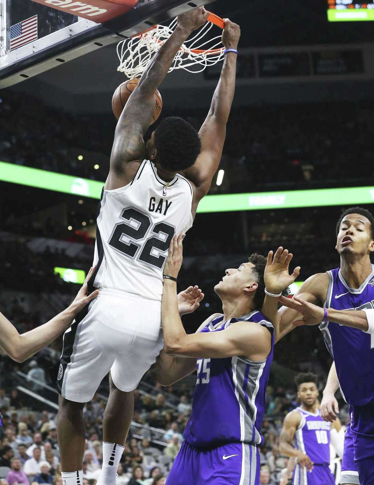 Rudy Gay leaves the defense on the floor for a dunk in the first half as the Spurs play the Kings at the AT&T Center on October 6, 2017.