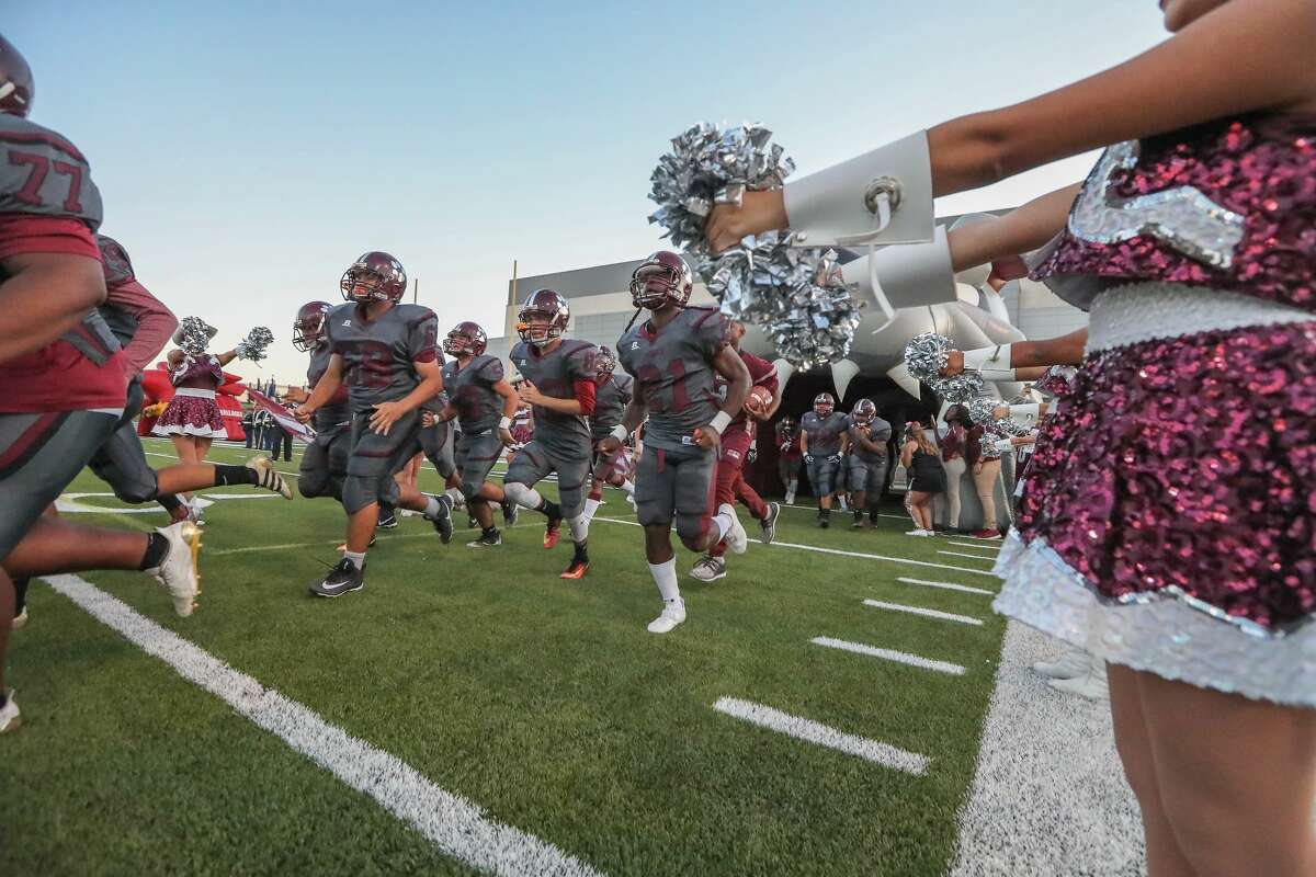 Bellaire's football team enters the field before taking on Heights at Delmar Stadium Friday, Oct. 6, 2017, in Houston. ( Steve Gonzales / Houston Chronicle )