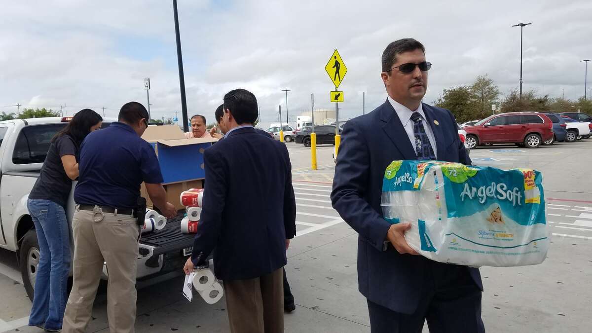 District Attorney Isidro R. “Chilo” Alaniz helps volunteers unload items from a vehicle. Alaniz and local members of the community are asking Laredoans to help out victims of the earthquake in Mexico and hurricane victims in Puerto Rico.