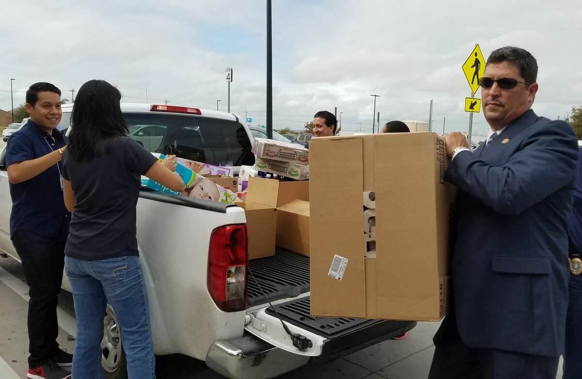 District Attorney Isidro R. “Chilo” Alaniz helps volunteers unload items from a vehicle. Alaniz and local members of the community are asking Laredoans to help out victims of the earthquake in Mexico and hurricane victims in Puerto Rico. 