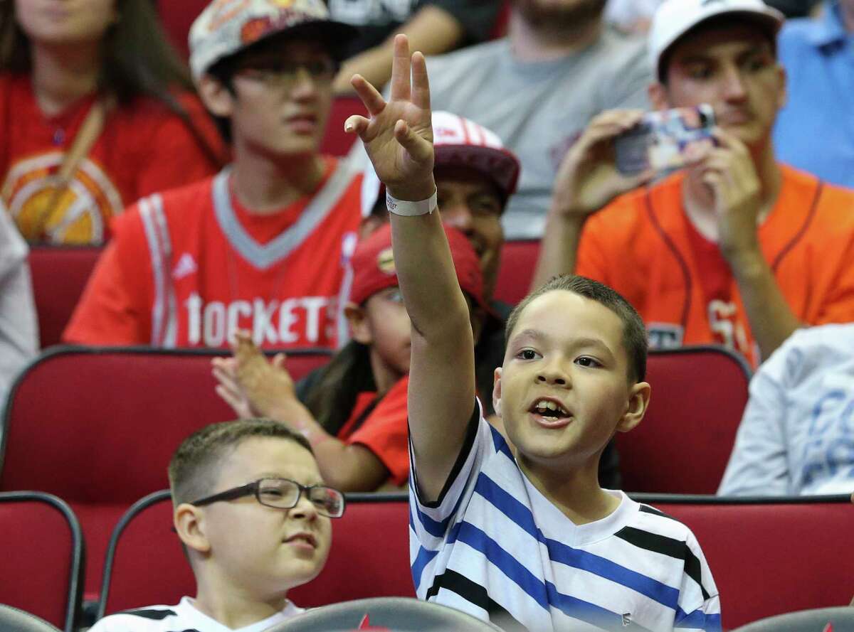 Houston Rockets fans cheer for players during the practice game at the fan fest at Toyota Center Saturday, Oct. 7, 2017, in Houston.