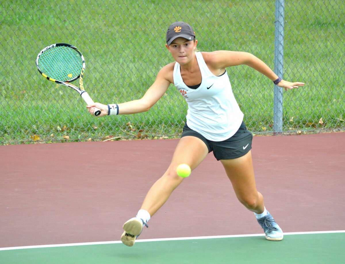 Edwardsville senior Grace Desse makes a forehand return during her No. 2 singles championship match on Saturday in the Southwestern Conference Tournament at the EHS Tennis Center.