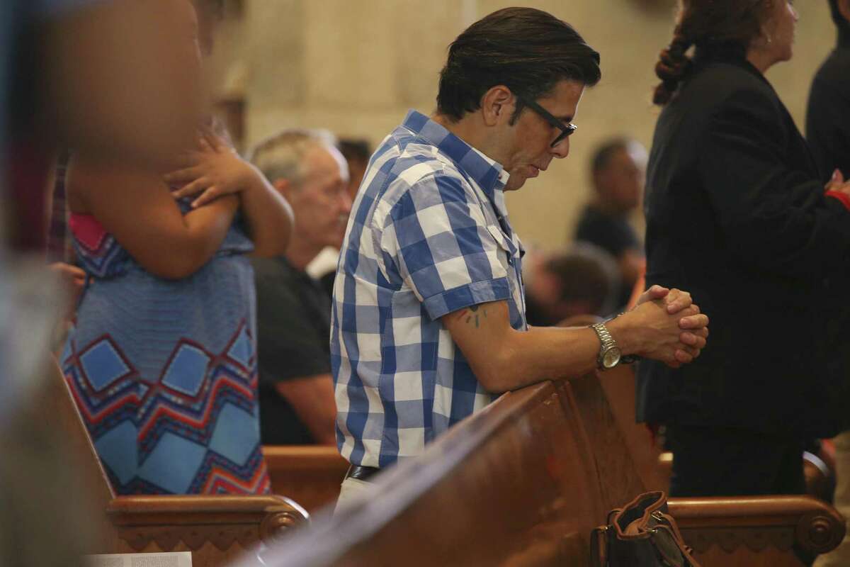 Joel attends services at San Fernando Cathedral, Sunday, August 20, 2017. He was diagnosed with AIDS in the 1990's and is now HIV positive. Joel asked his last name not be used.