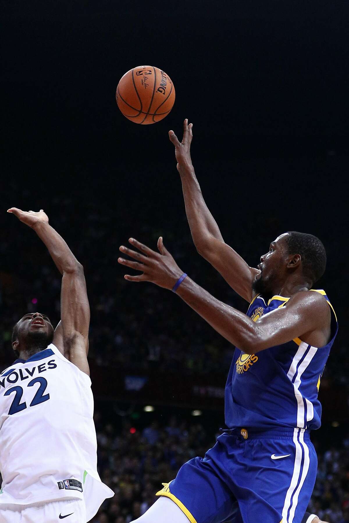 SHENZHEN, CHINA - OCTOBER 05: Kevin Durant #35 of the Golden State Warriors in action against Andrew Wiggins #22 of the Minnesota Timberwolves during the game between the Minnesota Timberwolves and the Golden State Warriors as part of 2017 NBA Global Games China at Universidade Center on October 5, 2017 in Shenzhen, China. (Photo by Zhong Zhi/Getty Images)