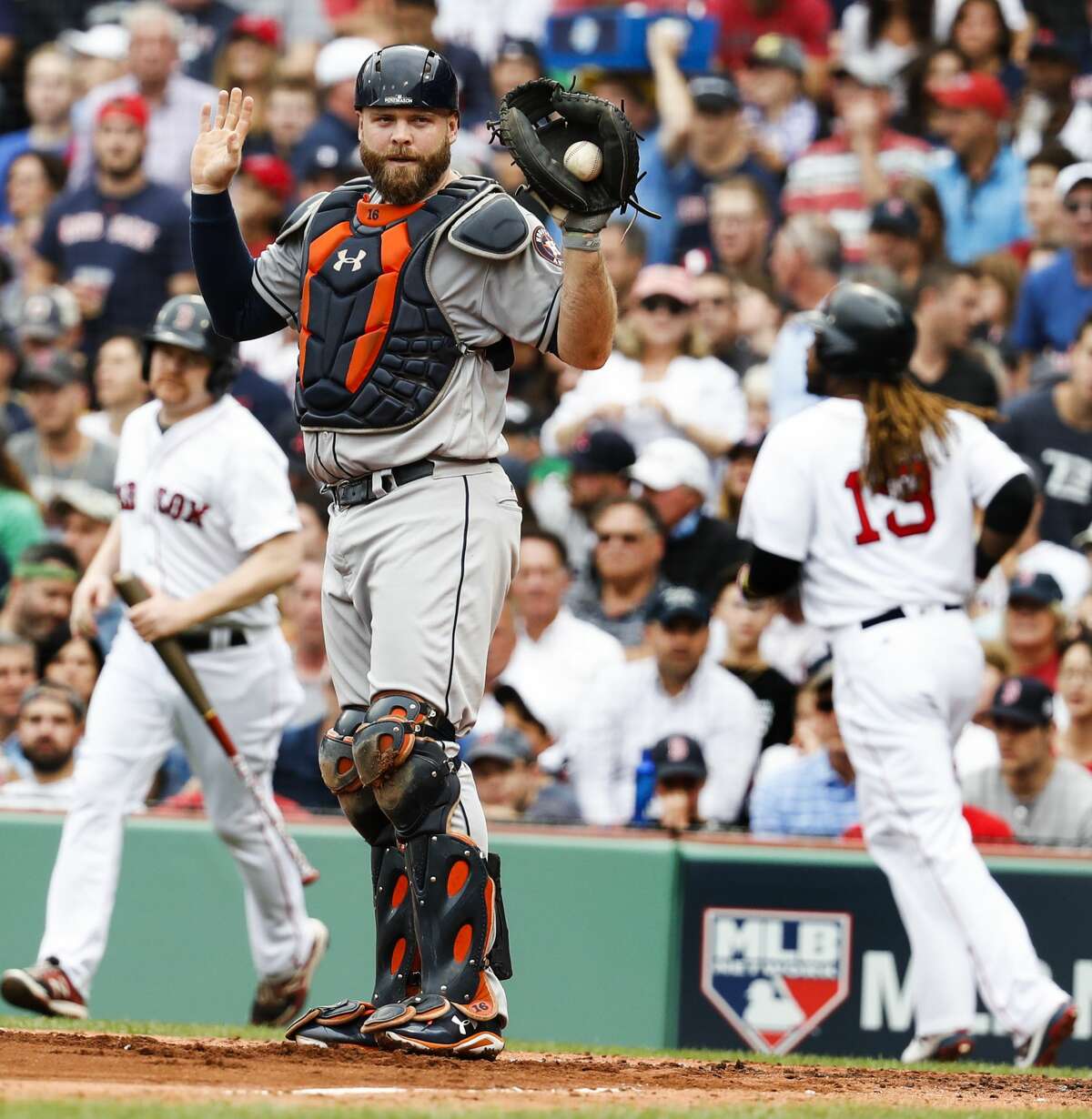 Houston Astros catcher Brian McCann calls time after forcing out Boston Red Sox designated hitter Hanley Ramirez (13) at home on a grounder by Boston Red Sox shortstop Xander Bogaerts during the second inning of the ALDS Game 3 at Fenway Park, Sunday, Oct. 8, 2017, in Boston . ( Karen Warren / Houston Chronicle )