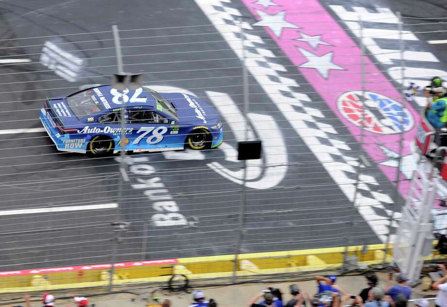 Martin Truex Jr Takes The Checkered Flag To Win A NASCAR Cup Series Auto Race Martin Truex Jr Takes The Checkered Flag To Win A NASCAR Cup Series Auto Race