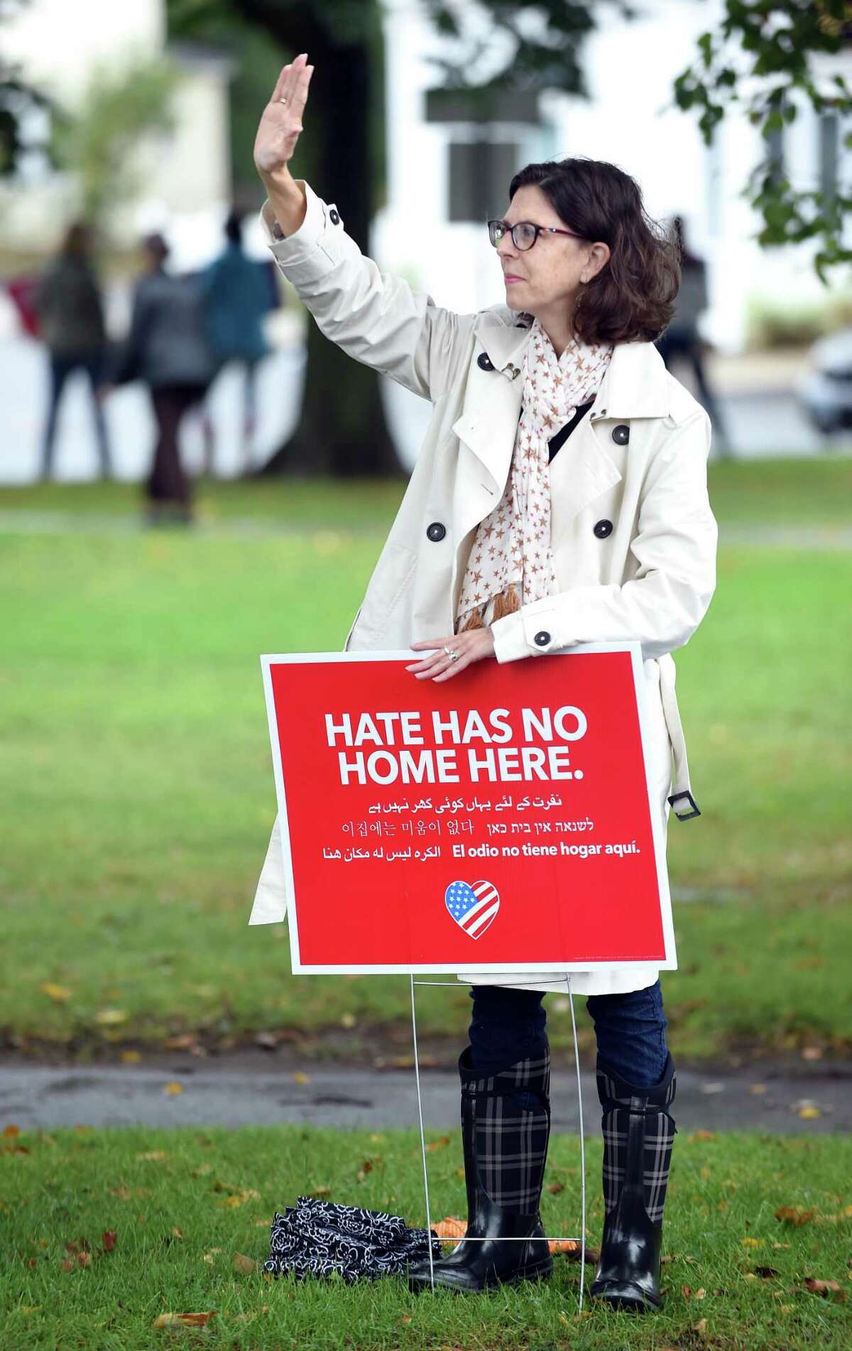 Milford antirally gets honks thumbs up from passers by