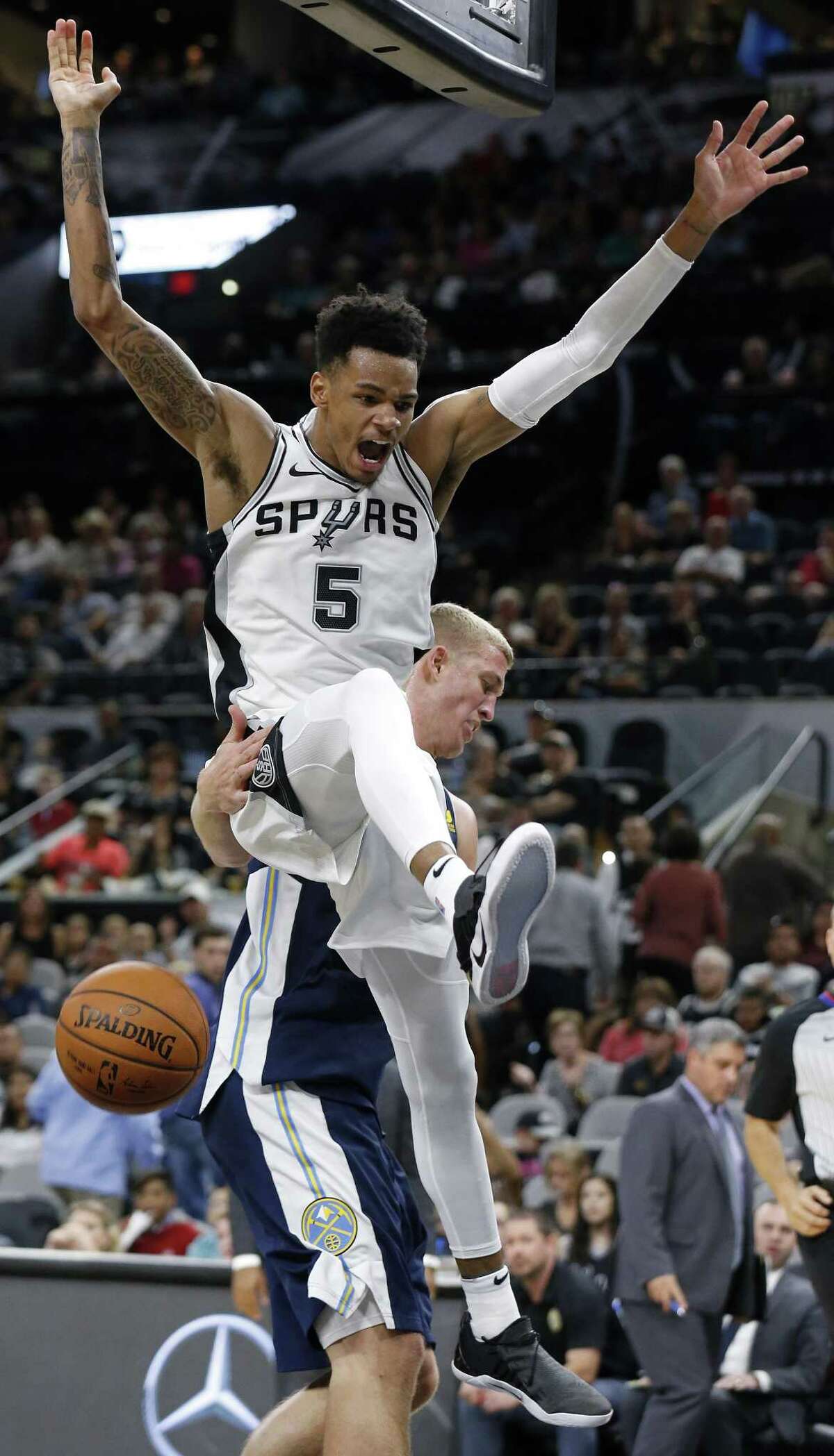 San Antonio Spurs?• Dejounte Murray reacts after a dunk around Denver Nuggets?• Mason Plumlee during second half action of their preseason game held Sunday Oct. 8, 2017 at the AT&T Center. The Spurs won 122-100.