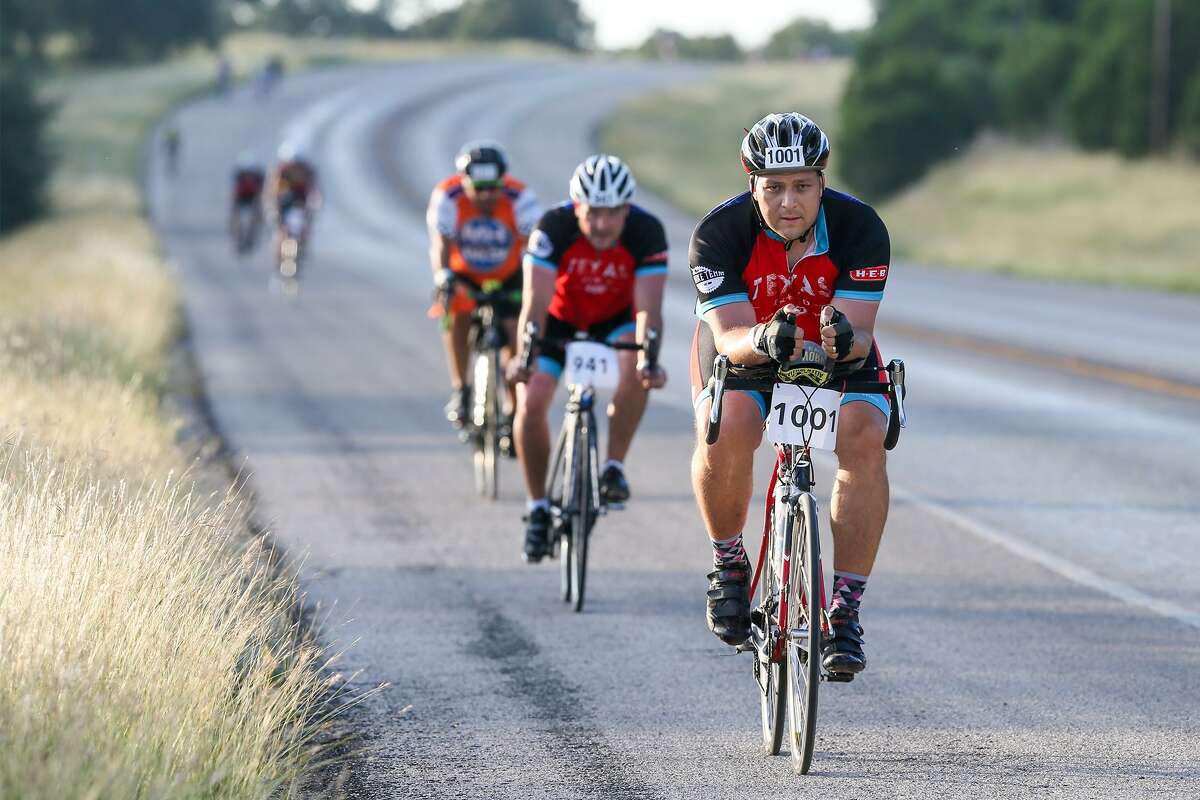 Cyclists make their way down FM 2272 near Canyon Lake. About 1,300 cyclists helped raise more than $1 million in the two-day event, riding up to 161 miles.
