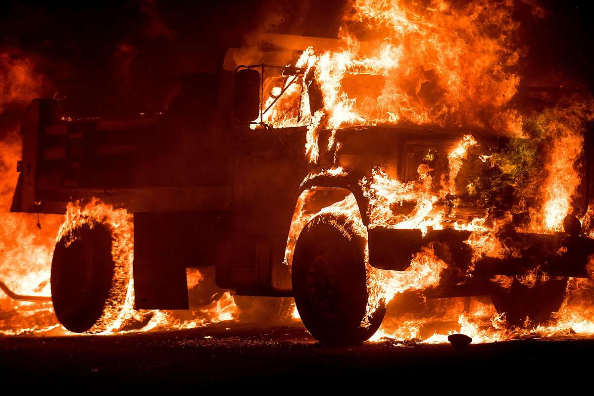 Flames consume a truck on Soda Canyon Road in Napa, Calif., on Monday, Oct. 9, 2017.