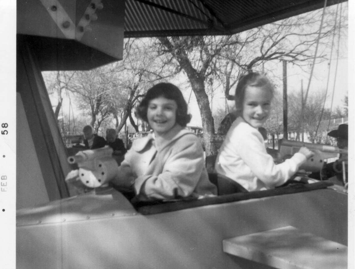 Its original little cars and warplanes still spin, too. Two of Kiddie Park’s oldest ongoing amusements are its miniature automobiles from the 1920s and World War II-era airplanes from the 1940s. Pictured are Cathy Raffkind and Christine Posey (right) in a 1958 family snapshot.