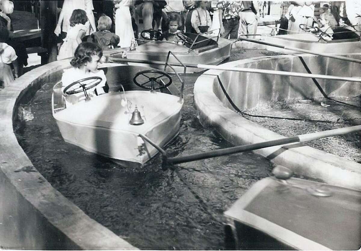 A child on the Kiddie Park boat ride in 1953.