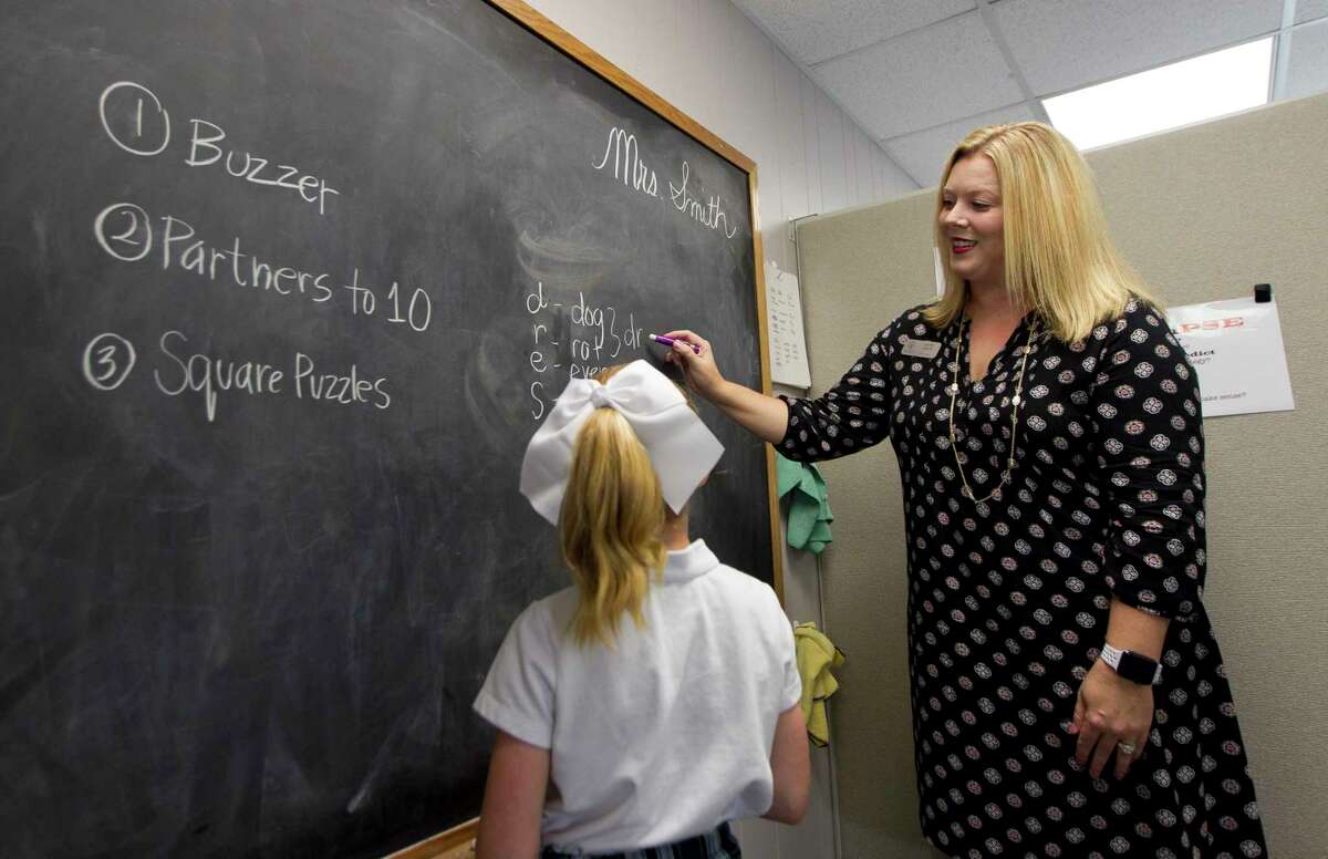 Education therapist Katie Smith works through an activity with a student during a one-on-one session at The Woodlands Christian Academy, Wednesday, Oct. 4, 2017, in The Woodlands. Smith and other therapists at the school recently advanced from level I to level II in the National Institute for Learning Development's professional certification program. The distinction gives therapists additional tools to do more in-depth one-on-one training.