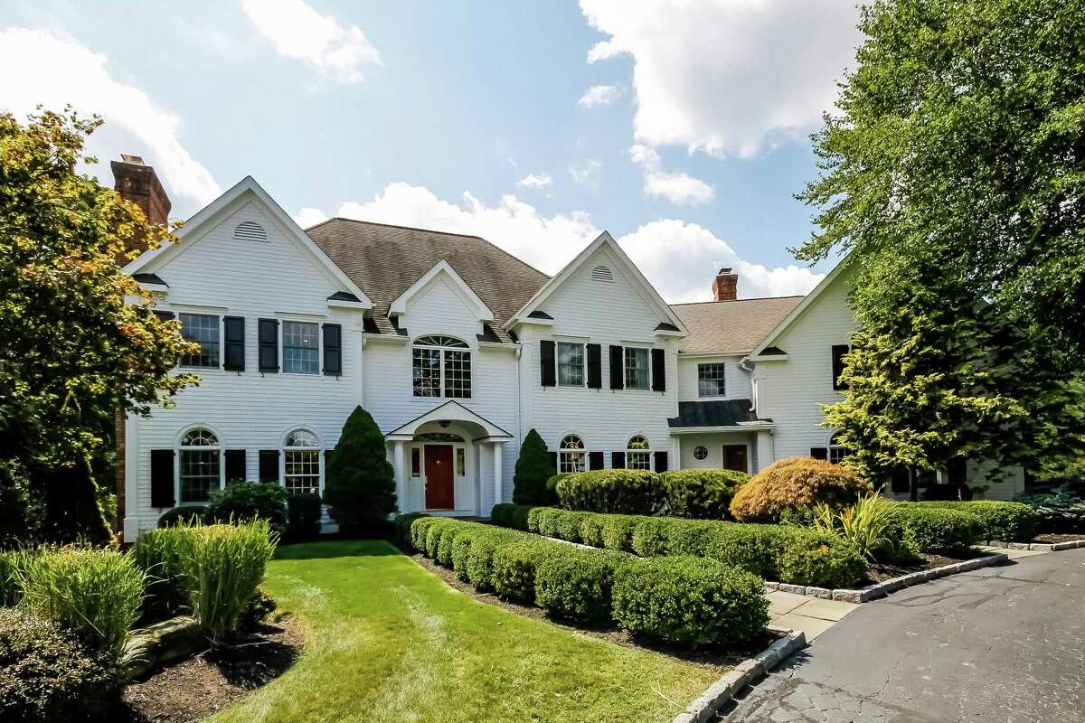 The stately white colonial house at 167 Sturges Ridge Road was recently completely renovated, giving it a transitional feel with an open floor plan.