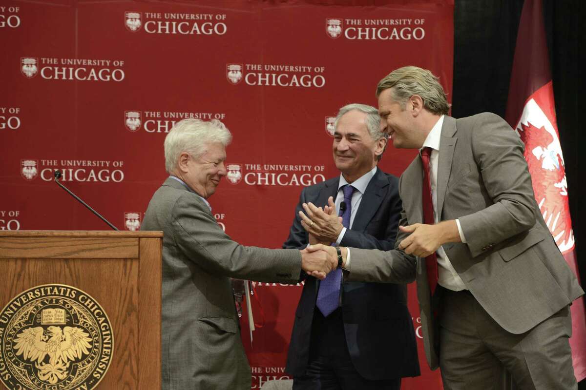 University of Chicago professor Richard Thaler left, shakes hands with University of Chicago provost Dan Diermeir right, while University of Chicago president Robert J. Zimmer, center, looks on during a news conference announcing Thaler as the winner of the Nobel economics prize Monday, Oct. 9, 2017, in Chicago. Thaler won for documenting the way peoples behavior doesnt conform to economic models. As one of the founders of behavioral economics, he has helped change the way economists look at the world.
