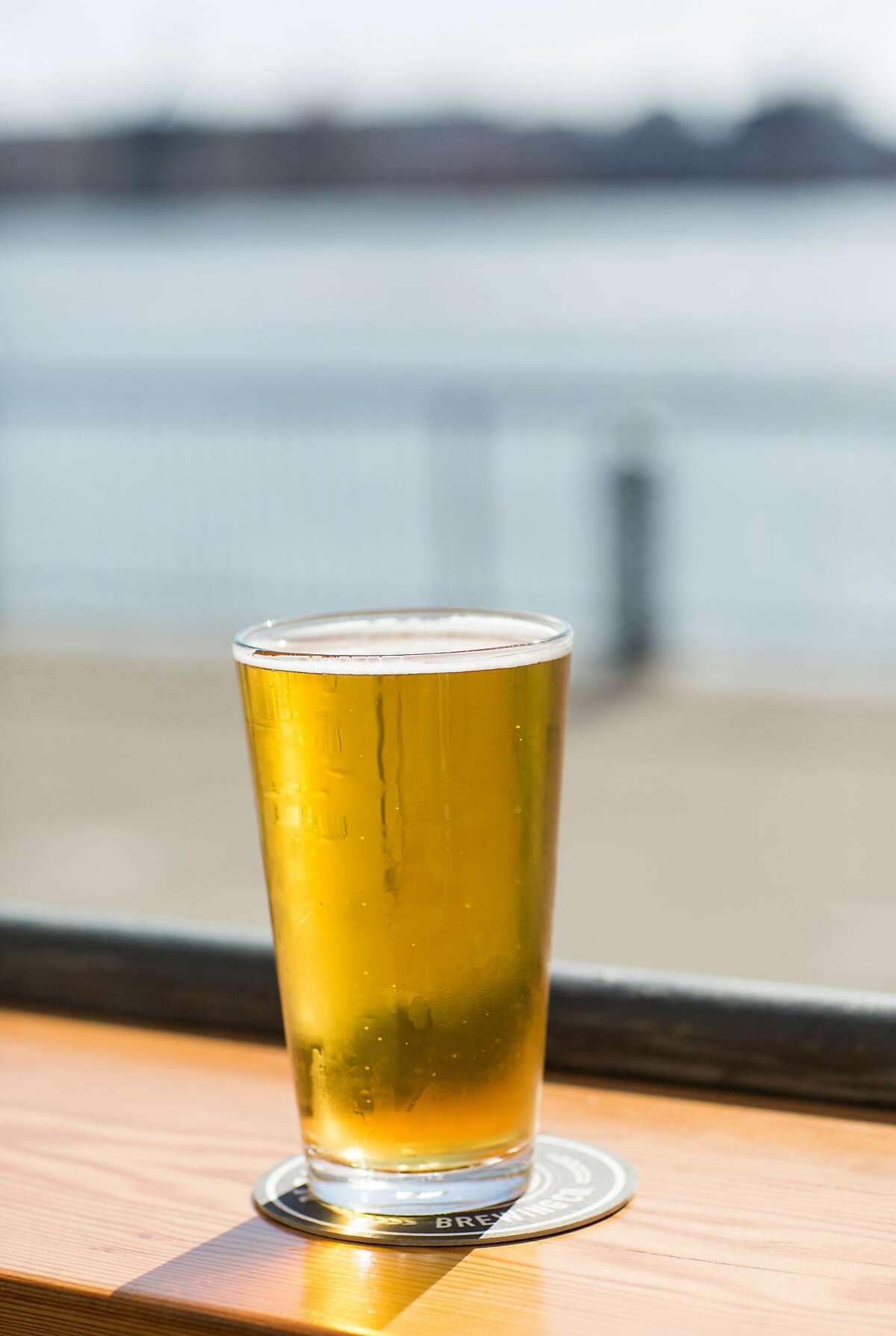 A glass of Saginaw Golden Ale, the flagship ale of Mare Island Brewing Co., is seen at their taproom in the Vallejo Ferry Building in Vallejo, Calif., on Saturday, September 30, 2017. The brewery is in the final construction stages at the historic Coal Sheds on Mare Island where where they will be doing all their brewing.