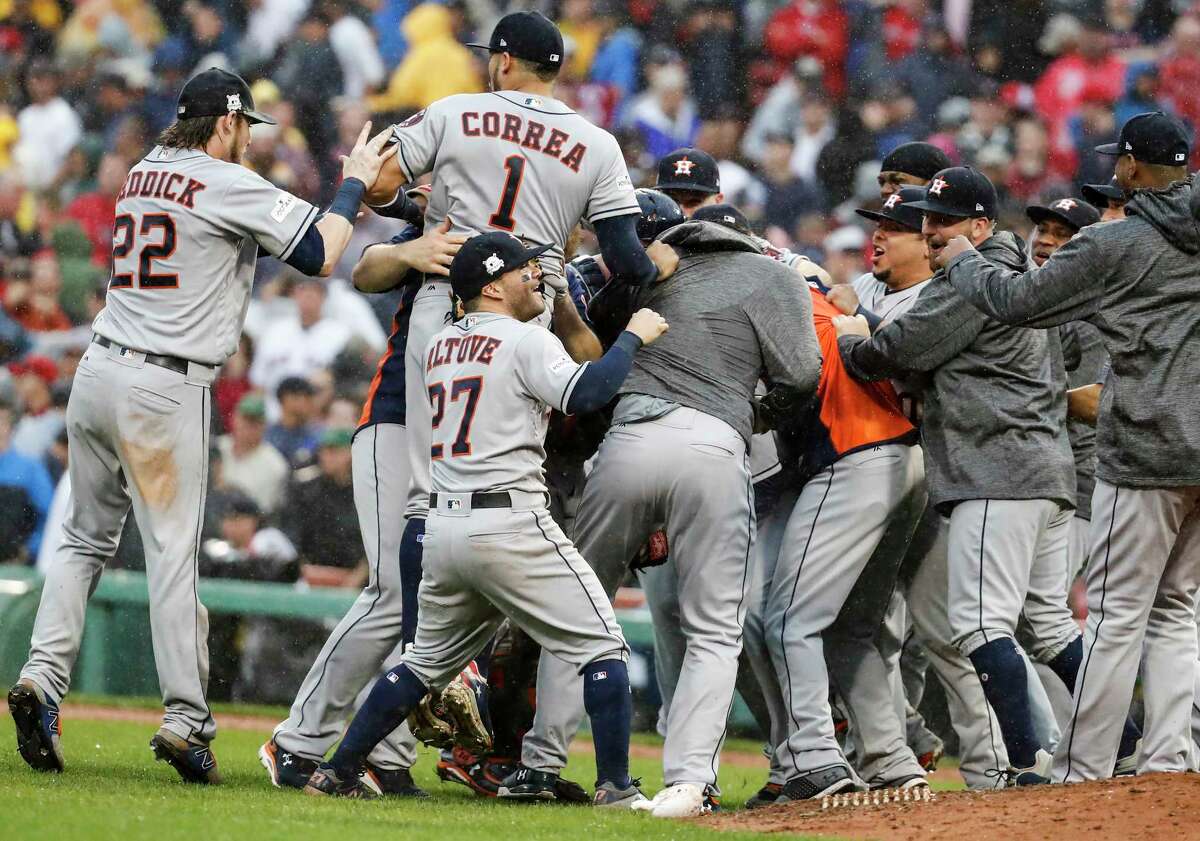 The Houston Astros celebrate the Astros 5-4 win over the Boston Red Sox in Game of the ALDS at Fenway Park on Monday, Oct. 9, 2017, in Boston. The Astros won the series 3-1.