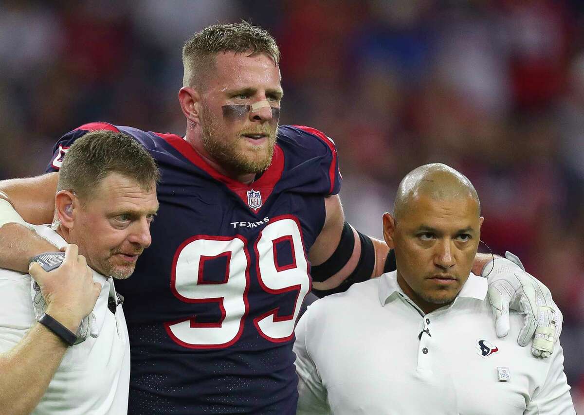 Houston Texans defensive end J.J. Watt (99) is helped off of the field after being injured during an NFL football game at NRG Stadium Sunday, Oct. 8, 2017 in Houston. ( Michael Ciaglo / Houston Chronicle)