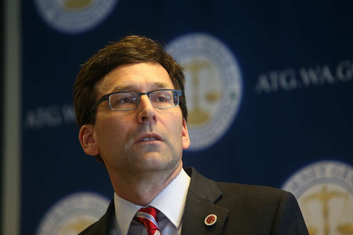 FILE-- Washington state Attorney General Bob Ferguson holds a press conference to discuss President Trump's new immigration Executive Order on March 6, 2017 in Seattle, Washington. Ferguson is set to announce a new lawsuit against the Trump Administration over a decision to allow plans for 3D-printer guns to be published on the internet.