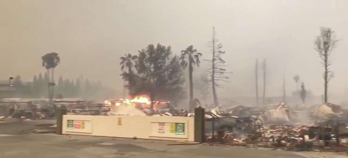 The remnants of several mobile homes can be seen from the outside of Journey's End mobile home park in Santa Rosa, Calif. on Monday.