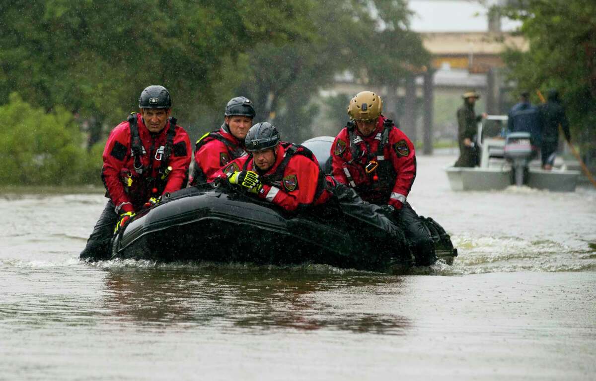 HOUSTON, TX - AUGUST 28: Houston Fire Department Dive Team members motor through high water on North Braeswood Blvd in Houston, Texas looking for victims of the flooding from Hurricane Harvey August 28, 2017 (Photo by Erich Schlegel/Getty Images)