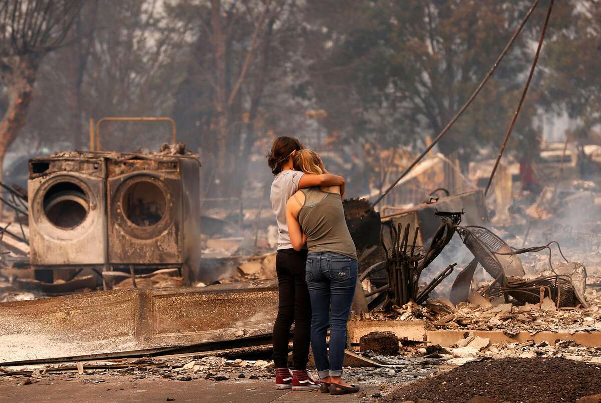 Steph Gediman, (left) comforts Brandi Burns in front of Burns' destroyed at the scene of the Tubbs Fire in Santa Rosa, Ca., on Monday October 9, 2017. Massive wildfires ripped through Napa and Sonoma counties early Monday, destroying hundreds of homes and businesses on Monday October 9, 2017