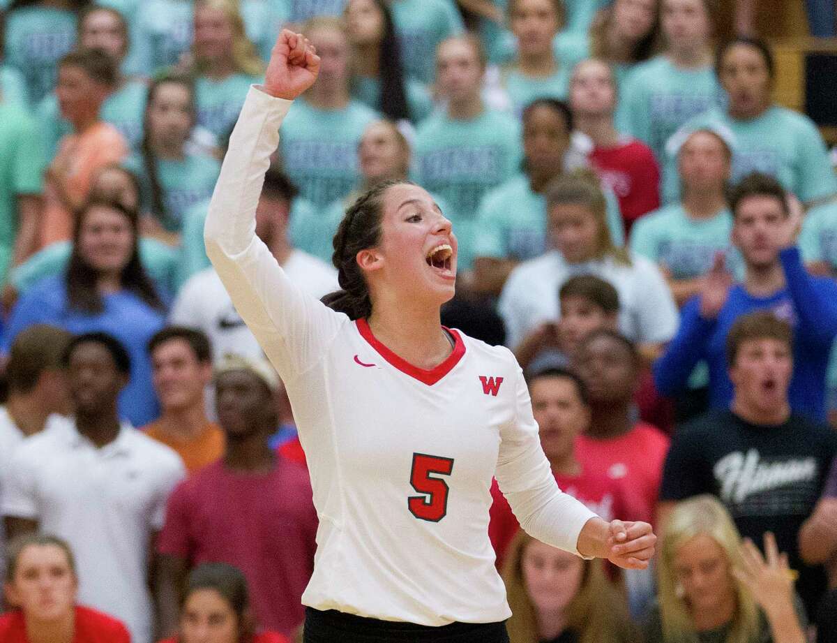The Woodlands' Georgia Murphy (5) celebrates a point during the second set of a District 12-6A high school volleyball match at The Woodlands High School, Tuesday, Oct. 10, 2017, in The Woodlands.