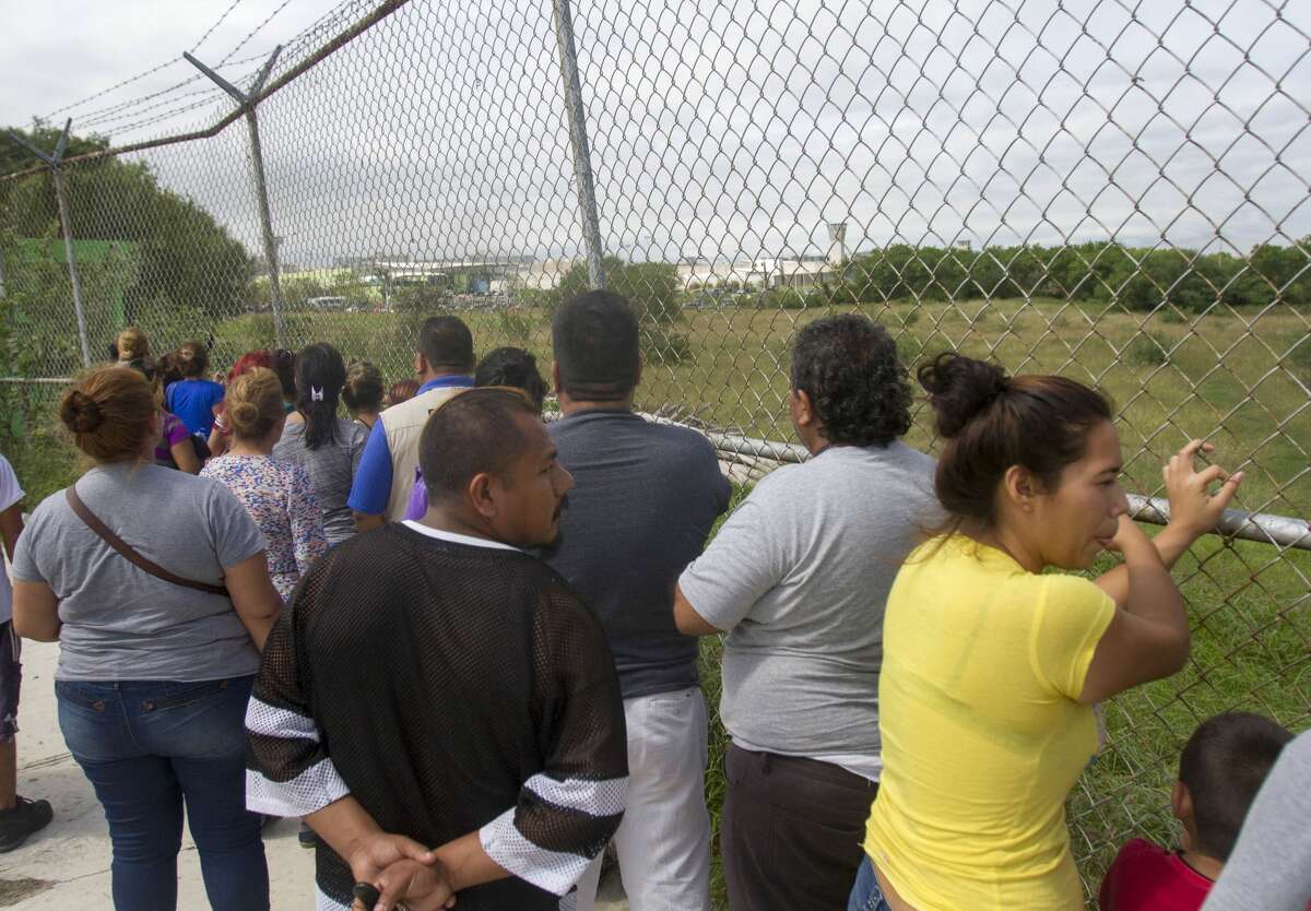 Relatives of inmates wait outside the Cadereyta prison where a brawl among the prisoners left several wounded on October 10, 2017 in Cadereyta, Nuevo Leon, Mexico. / AFP PHOTO / Julio Cesar AGUILAR (Photo credit should read JULIO CESAR AGUILAR/AFP/Getty Images)