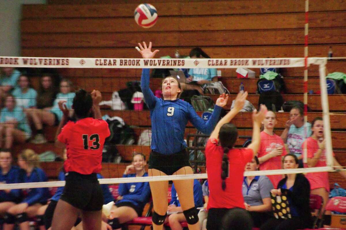 Friendswood's Lauren Hubbard (9) tips the ball over the net against Clear Brook Tuesday, Oct 10.