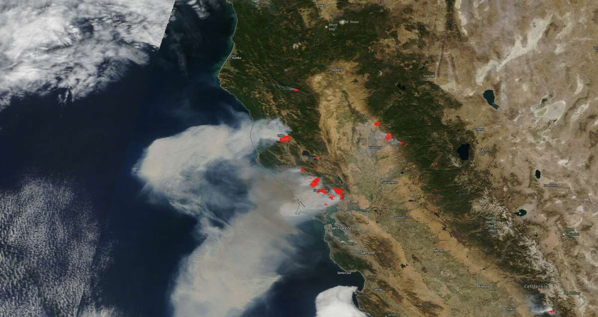 NASA's satellites captured the smoke from Northern California wildfires. The red dots indicate where fires are burning.