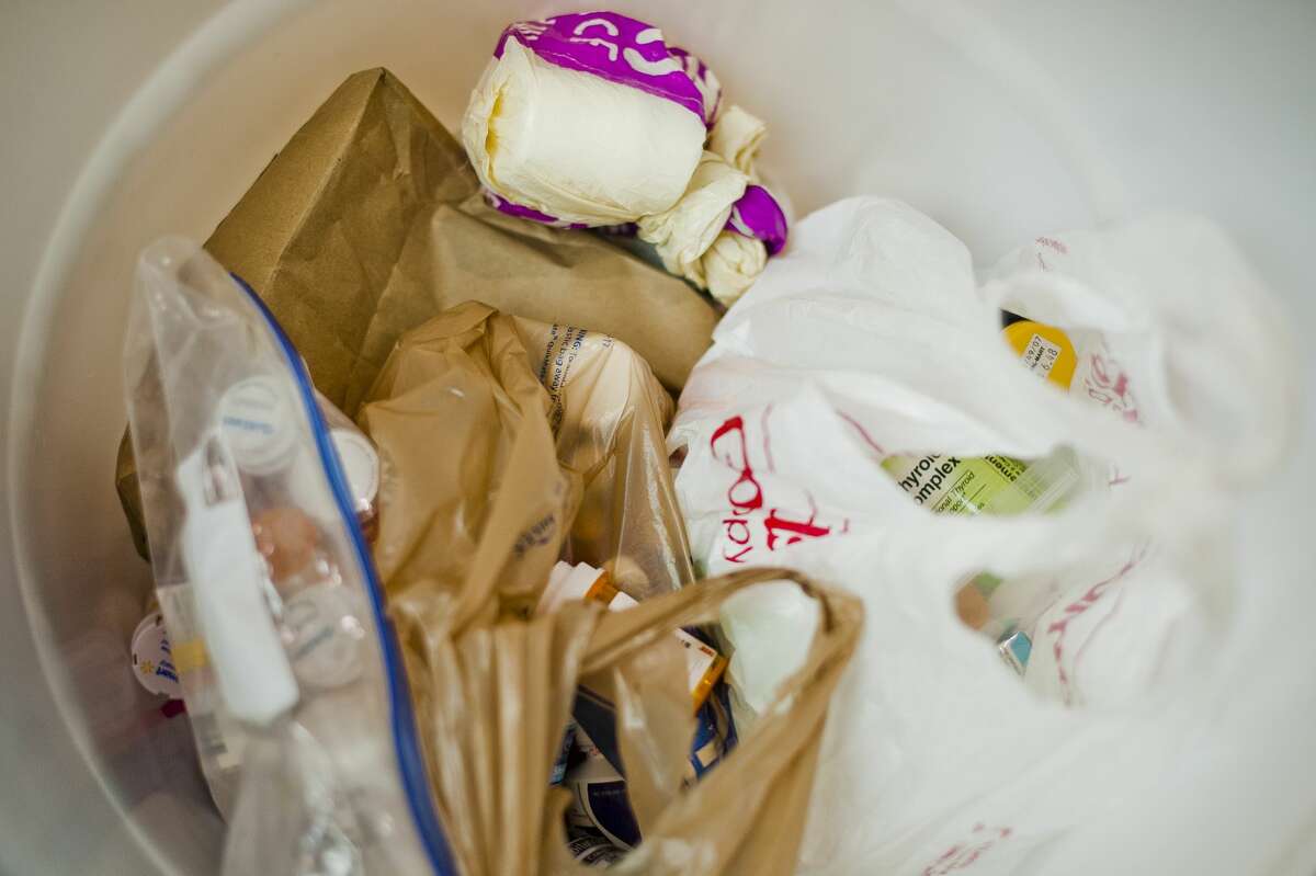 Medications are collected in a bin during a "Dump Your Drugs" event on Wednesday at the Midland Mall. (Katy Kildee/kkildee@mdn.net)